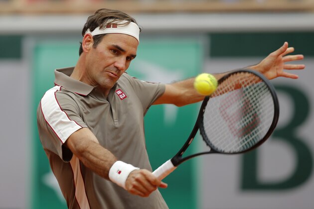 Switzerland's Roger Federer plays a shot against Italy's Lorenzo Sonego during their first round match of the French Open tennis tournament at the Roland Garros stadium in Paris, Sunday, May 26, 2019. (AP Photo/Michel Euler )
