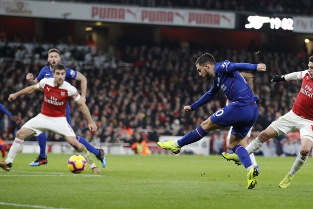 Chelsea's Eden Hazard, second right shoots at goalduring the English Premier League soccer match between Arsenal and Chelsea at the Emirates stadium in London, Saturday, Jan. 19, 2019. (AP Photo/Frank Augstein)