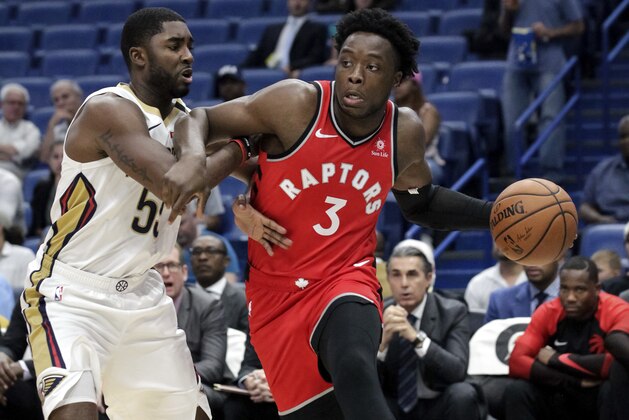 Toronto Raptors forward OG Anunoby (3) drives against New Orleans Pelicans guard E'Twaun Moore (55) during the first half of a preseason NBA basketball game in New Orleans, Thursday, Oct. 11, 2018. (AP Photo/Scott Threlkeld)