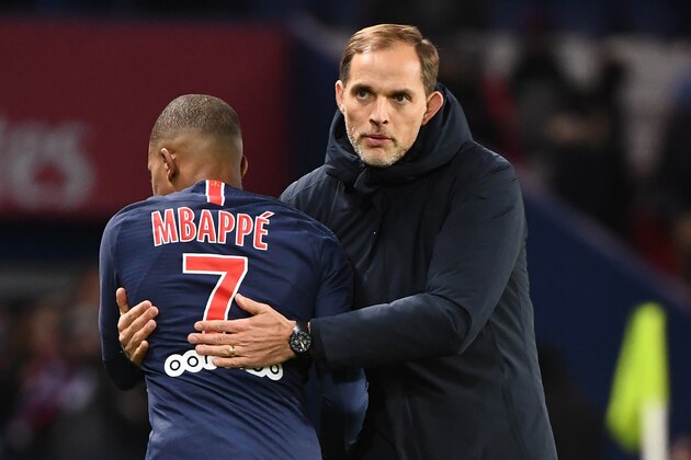 Paris Saint-Germain's French forward Kylian Mbappe (L) is congratulated by Paris Saint-Germain's German coach Thomas Tuchel at the end of the French L1 football match between Paris Saint-Germain (PSG) and Stade Rennais FC, at the Parc des Princes stadium, in Paris, on January 27, 2019. (Photo by FRANCK FIFE / AFP)        (Photo credit should read FRANCK FIFE/AFP/Getty Images)