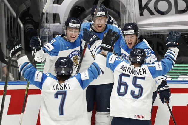 Finland's Marko Anttila, center, celebrates with Oliwer Kaski (7), Kaapo Kakko (24), Niko Ojamaki (20), and Sakari Manninen (65) after Anttila scored a goal against Canada during the Ice Hockey World Championships gold medal match at the Ondrej Nepela Arena in Bratislava, Slovakia, Sunday, May 26, 2019. (AP Photo/Petr David Josek)