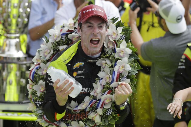 Simon Pagenaud, of France, celebrates after winning the Indianapolis 500 IndyCar auto race at Indianapolis Motor Speedway, Sunday, May 26, 2019, in Indianapolis. (AP Photo/Darron Cummings)