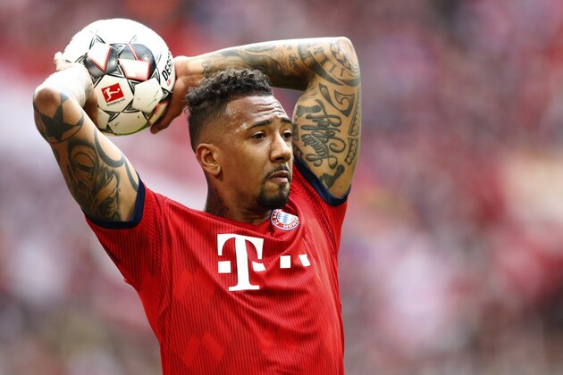 Bayern's Jerome Boateng throws the ball during the German Bundesliga soccer match between FC Bayern Munich and VfL Wolfsburg in Munich, Germany, Saturday, March 9, 2019. (AP Photo/Matthias Schrader)