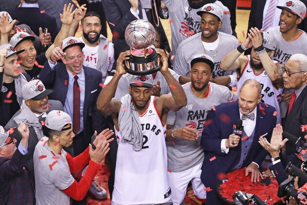 TORONTO, ON - MAY 25:  Kawhi Leonard #2 of the Toronto Raptors hoists the Eastern Conference Championship trophy after defeating the Milwaukee Bucks in Game Six of the NBA Eastern Conference Final at Scotiabank Arena on May 25, 2019 in Toronto, Ontario, Canada. The Raptors defeated the Bucks 100-94 to win the Eastern Conference Championship 4 games to 2. NOTE TO USER: user expressly acknowledges and agrees by downloading and/or using this Photograph, user is consenting to the terms and conditions of the Getty Images Licence Agreement. (Photo by Claus Andersen/Getty Images)