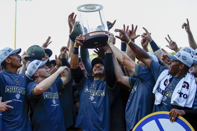 Vanderbilt celebrates with the trophy after defeating Mississippi to win the Southeastern Conference tournament NCAA college baseball championship game, Sunday, May 26, 2019, in Hoover, Ala. (AP Photo/Butch Dill)