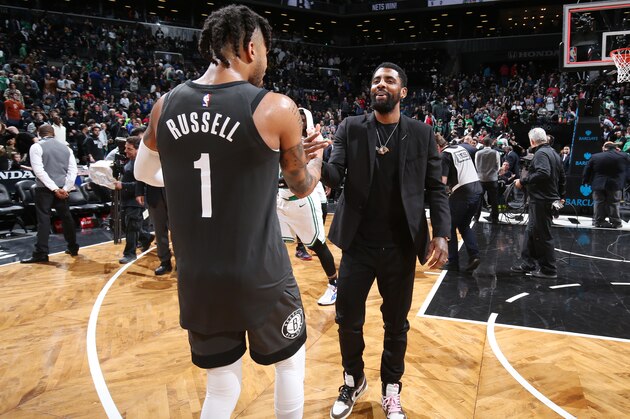 BROOKLYN, NY - MARCH 30: D'Angelo Russell #1 of the Brooklyn Nets and Kyrie Irving #11 of the Boston Celtics hug after the game on March 30, 2019 at Barclays Center in Brooklyn, New York. NOTE TO USER: User expressly acknowledges and agrees that, by downloading and or using this Photograph, user is consenting to the terms and conditions of the Getty Images License Agreement. Mandatory Copyright Notice: Copyright 2019 NBAE (Photo by Nathaniel S. Butler/NBAE via Getty Images)