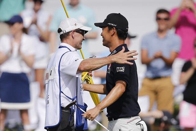 FORT WORTH, TEXAS - MAY 26:  Kevin Na of the United States celebrates with caddie, Kenny Harms, on the 18th green after winning the Charles Schwab Challenge at Colonial Country Club on May 26, 2019 in Fort Worth, Texas. (Photo by Michael Reaves/Getty Images)
