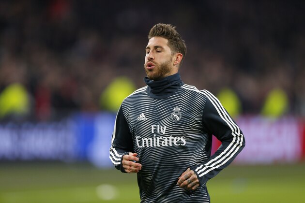 Real defender Sergio Ramos warms up during the first leg, round of sixteen, Champions League soccer match between Ajax and Real Madrid at the Johan Cruyff ArenA in Amsterdam, Netherlands, Wednesday Feb. 13, 2019. (AP Photo/Peter Dejong)