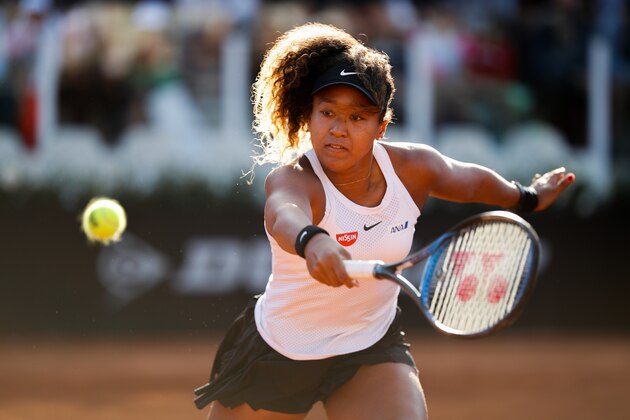 ROME, ITALY - MAY 16: Naomi Osaka of Japan plays a backhand against Mihaela Buzarnescu of Romania in their Women's Singles Round of 16 match during Day Five of the International BNL d'Italia at Foro Italico on May 16, 2019 in Rome, Italy. (Photo by Adam Pretty/Getty Images)