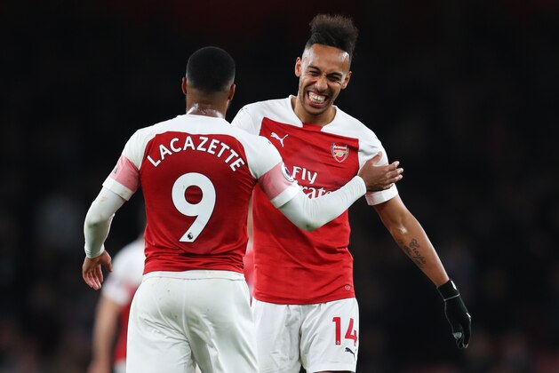 LONDON, ENGLAND - APRIL 01:  Pierre-Emerick Aubameyang (14) and Alexandre Lacazette of Arsenal celebrate victory after the the Premier League match between Arsenal FC and Newcastle United at Emirates Stadium on April 01, 2019 in London, United Kingdom. (Photo by Catherine Ivill/Getty Images)