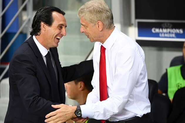 Paris Saint-Germain's Spanish head coach Unai Emery (L) shakes hands with Arsenal's French manager Arsene Wenger during the UEFA Champions League Group A football match between Paris-Saint-Germain and Arsenal FC on September 13, 2016 at the Parc des Princes stadium in Paris.  / AFP / FRANCK FIFE        (Photo credit should read FRANCK FIFE/AFP/Getty Images)