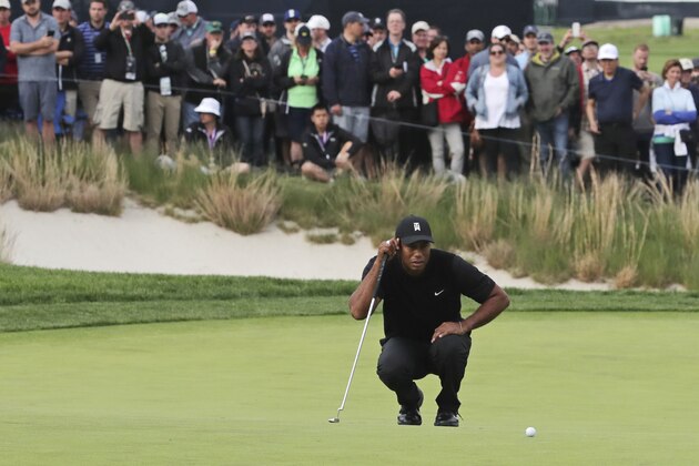 Tiger Woods lines up a putt on the 17th green during the second round of the PGA Championship golf tournament, Friday, May 17, 2019, at Bethpage Black in Farmingdale, N.Y. (AP Photo/Charles Krupa)