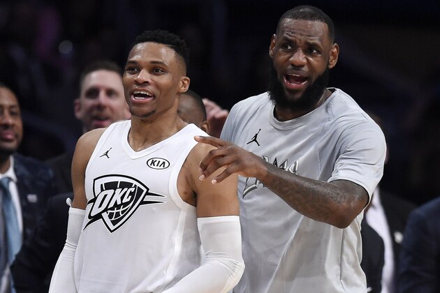 Team LeBron's Russell Westbrook, left, of the Oklahoma City Thunder, and Team LeBron's LeBron James, of the Cleveland Cavaliers, cheer from the bench during the first half of an NBA All-Star basketball game against Team , Sunday, Feb. 18, 2018, in Los Angeles. (AP Photo/Chris Pizzello)