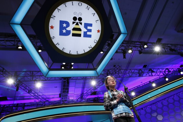 FILE - In this May 31, 2018 file photo, Lauren Guo, 12, from Arvada, Colo., competes in the Scripps National Spelling Bee in Oxon Hill, Md.  An unremarkable sound can be the toughest thing for spellers to master at the Scripps National Spelling Bee. It's known as the schwa. It sounds like