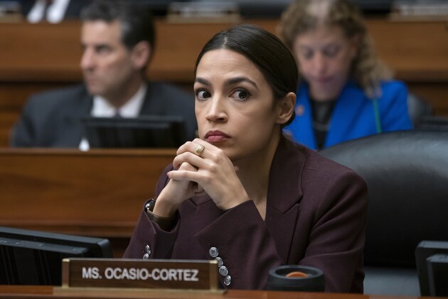 Rep. Alexandria Ocasio-Cortez, D-N.Y., listens to questioning of Michael Cohen, President Donald Trump's former personal lawyer, at the House Oversight and Reform Committee, on Capitol Hill in Washington, Wednesday, Feb. 27, 2019.  (AP Photo/J. Scott Applewhite)