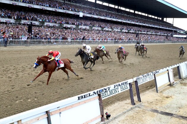 ELMONT, NY - JUNE 09:  Justify #1, ridden by jockey Mike Smith crosses the finish line to win the 150th running of the Belmont Stakes at Belmont Park on June 9, 2018 in Elmont, New York. Justify becomes the thirteenth Triple Crown winner and the first since American Pharoah in 2015.  (Photo by Al Bello/Getty Images)
