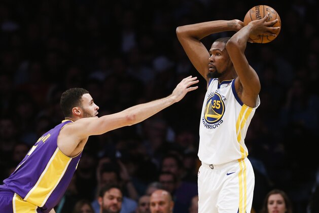 Golden State Warriors forward Kevin Durant #35 and Los Angeles Lakers forward Larry Nance Jr. #7 in actions during an NBA basketball game Wednesday, Nov. 29, 2017, in Los Angeles. Golden State Warriors won 127-123 in overtime. (AP Photo/Ringo H.W. Chiu)