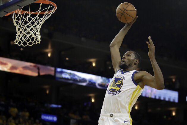 Golden State Warriors' Kevin Durant lays up a shot against the Los Angeles Clippers in the second half in Game 1 of a first-round NBA basketball playoff series Saturday, April 13, 2019, in Oakland, Calif. (AP Photo/Ben Margot)
