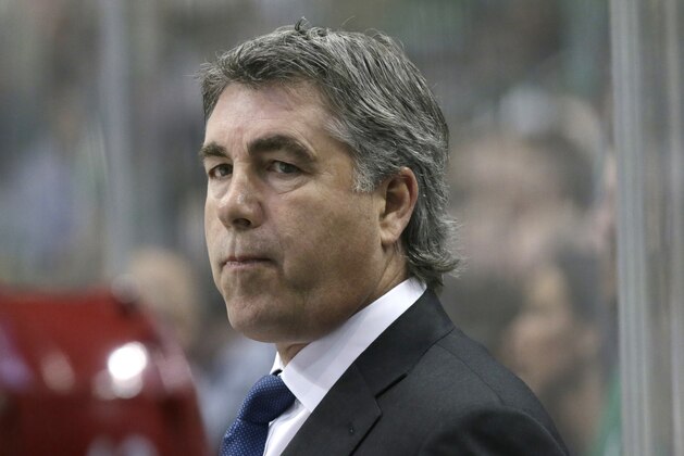 FILE - In this March 31, 2016 file photo Arizona Coyotes head coach Dave Tippett looks on from the bench during the first period of an NHL hockey game against the Dallas Stars in Dallas. Seattle can now begin plotting the course of its hockey future after the NHL awarded the city an expansion franchise that begins play in 2021.  Tippett will be in charge of building a hockey operations department and have a say in who will be the team’s first general manager. The pressure is on to win right away after the Vegas Golden Knights reached the Stanley Cup Final in their inaugural season. (AP Photo/LM Otero, file)