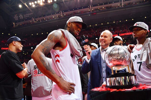 TORONTO, CANADA - MAY 25: Ernie Johnson interviews Kawhi Leonard #2 of the Toronto Raptors after a game between the Milwaukee Bucks and the Toronto Raptors during Game Six of the Eastern Conference Finals on May 25, 2019 at Scotiabank Arena in Toronto, Ontario, Canada. NOTE TO USER: User expressly acknowledges and agrees that, by downloading and/or using this photograph, user is consenting to the terms and conditions of the Getty Images License Agreement. Mandatory Copyright Notice: Copyright 2019 NBAE (Photo by Jesse D. Garrabrant/NBAE via Getty Images)