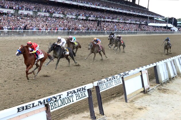 ELMONT, NY - JUNE 09:  Justify #1, ridden by jockey Mike Smith crosses the finish line to win the 150th running of the Belmont Stakes at Belmont Park on June 9, 2018 in Elmont, New York. Justify becomes the thirteenth Triple Crown winner and the first since American Pharoah in 2015.  (Photo by Al Bello/Getty Images)