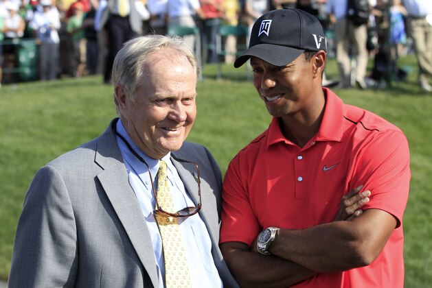 Jack Nicklaus, left, talks with Tiger Woods after Woods won the Memorial golf tournament at the Muirfield Village Golf Club in Dublin, Ohio, Sunday, June 3, 2012. (AP Photo/Tony Dejak)