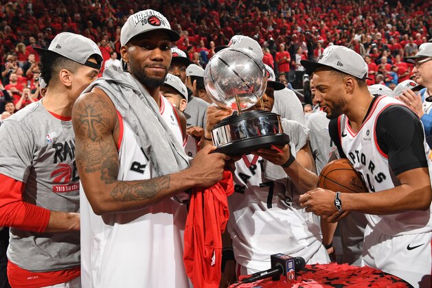 TORONTO, CANADA - MAY 25:  Kawhi Leonard #2 of the Toronto Raptors holds up the trophy after defeating the Milwaukee Bucks in Game Six of the Eastern Conference Finals on May 25, 2019 at Scotiabank Arena in Toronto, Ontario, Canada. NOTE TO USER: User expressly acknowledges and agrees that, by downloading and/or using this photograph, user is consenting to the terms and conditions of the Getty Images License Agreement. Mandatory Copyright Notice: Copyright 2019 NBAE (Photo by Ron Turenne/NBAE via Getty Images)