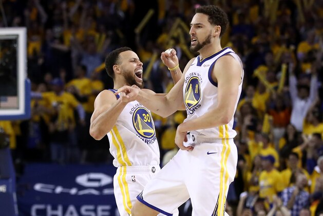 OAKLAND, CALIFORNIA - MAY 08:   Stephen Curry #30 of the Golden State Warriors celebrates with Klay Thompson #11 after Thompson made the clinching basket with four second left of their game against the Houston Rockets in Game Five of the Western Conference Semifinals of the 2019 NBA Playoffs at ORACLE Arena on May 08, 2019 in Oakland, California.  NOTE TO USER: User expressly acknowledges and agrees that, by downloading and or using this photograph, User is consenting to the terms and conditions of the Getty Images License Agreement.  (Photo by Ezra Shaw/Getty Images)