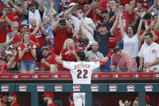 Cincinnati Reds' Derek Dietrich (22) acknowledges the fans following a two-run home run off Pittsburgh Pirates relief pitcher Geoff Hartlieb, his third of the game, during the seventh inning of a baseball game, Tuesday, May 28, 2019, in Cincinnati. (AP Photo/Gary Landers)