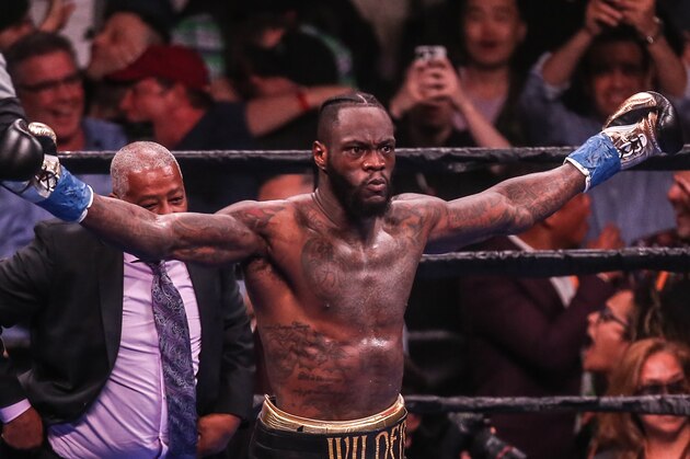 NEW YORK, NEW YORK - MAY 18: Deontay Wilder looks at the crowd and celebrates after knocking out   Dominic Breazeale in the first round during their bout for Wilder's WBC heavyweight championship at Barclays Center on May 18, 2019 in New York City. (Photo by Anthony Geathers/Getty Images)