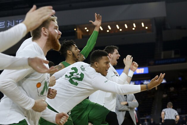 FILE - In this Saturday, March 10, 2018, file photo, then-Marshall guard Phil Bledsoe (32) and the Marshall bench react to a 3-point shot against Western Kentucky during the second half of the NCAA Conference USA basketball championship game in Frisco, Texas. Confusion over the new rule allowing college basketball players to sign with agents has led to uncertainty for Bledsoe, now at Division II Glenville State in West Virginia. (AP Photo/Michael Ainsworth, File)
