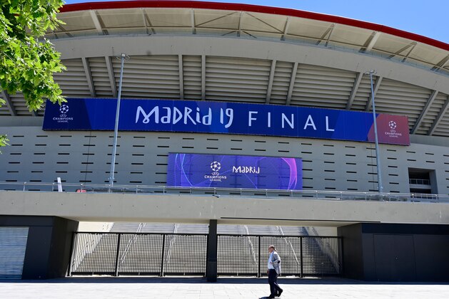 A man walks past the Wanda Metropolitan Stadium in Madrid on May 29, 2019 ahead of the UEFA Champions League final football match between Liverpool and Tottenham Hotspur on June 1. (Photo by Javier SORIANO / AFP)        (Photo credit should read JAVIER SORIANO/AFP/Getty Images)