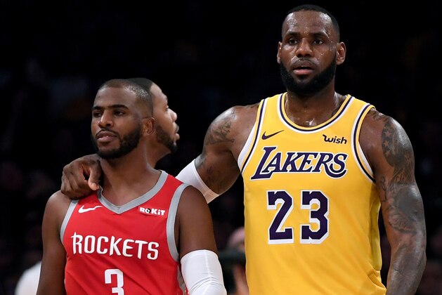 LOS ANGELES, CA - OCTOBER 20:  LeBron James #23 of the Los Angeles Lakers escorts Chris Paul #3 of the Houston Rockets after a fight involving Rajon Rondo #9 and Brandon Ingram #14 during a 124-115 Rockets win at Staples Center on October 20, 2018 in Los Angeles, California.  (Photo by Harry How/Getty Images)