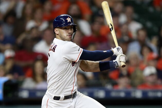 HOUSTON, TEXAS - MAY 22: Carlos Correa #1 of the Houston Astros doubles in a run in the fourth inning against the Chicago White Sox at Minute Maid Park on May 22, 2019 in Houston, Texas. (Photo by Bob Levey/Getty Images)