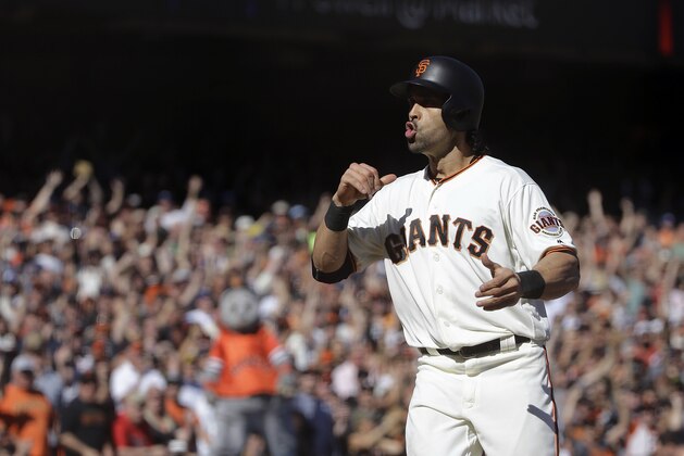 San Francisco Giants' Angel Pagan reacts after scoring against the Los Angeles Dodgers during the seventh inning of a baseball game in San Francisco, Saturday, Oct. 1, 2016. (AP Photo/Jeff Chiu)