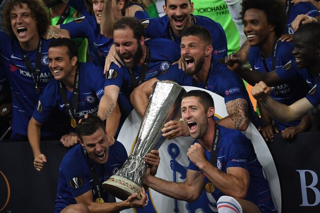 Chelsea's players celebrate with the trophy after winning the UEFA Europa League final football match between Chelsea FC and Arsenal FC at the Baku Olympic Stadium in Baku, Azerbaijian, on May 29, 2019. (Photo by OZAN KOSE / AFP)        (Photo credit should read OZAN KOSE/AFP/Getty Images)