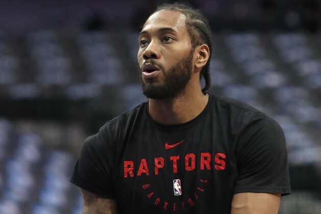 Toronto Raptors forward Kawhi Leonard lines up a free throw during warm ups before an NBA basketball game against the Dallas Mavericks in Dallas, Sunday, Jan. 27, 2019. (AP Photo/LM Otero)