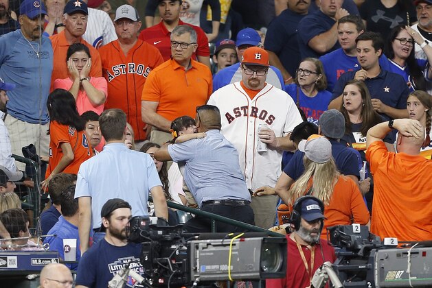 HOUSTON, TEXAS - MAY 29: A young child is rushed from the stands after being injured by a hard foul ball off the bat of Albert Almora Jr. #5 of the Chicago Cubs in the fourth inning at Minute Maid Park on May 29, 2019 in Houston, Texas. (Photo by Bob Levey/Getty Images)