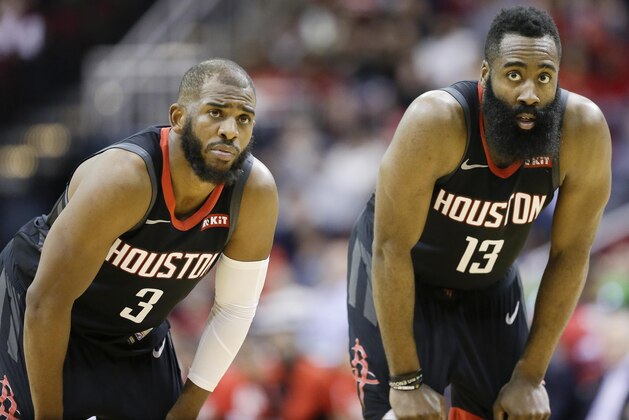 Houston Rockets guard Chris Paul, left, and guard James Harden look on during the second half of an NBA basketball game against the Atlanta Hawks, Monday, Feb. 25, 2019, in Houston. (AP Photo/Eric Christian Smith)