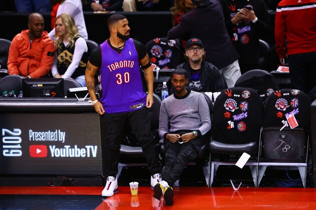 TORONTO, ONTARIO - MAY 30:  Rapper Drake is seen wearing a Dell Curry jersey before Game One of the 2019 NBA Finals between the Golden State Warriors and the Toronto Raptors at Scotiabank Arena on May 30, 2019 in Toronto, Canada. NOTE TO USER: User expressly acknowledges and agrees that, by downloading and or using this photograph, User is consenting to the terms and conditions of the Getty Images License Agreement. (Photo by Vaughn Ridley/Getty Images)