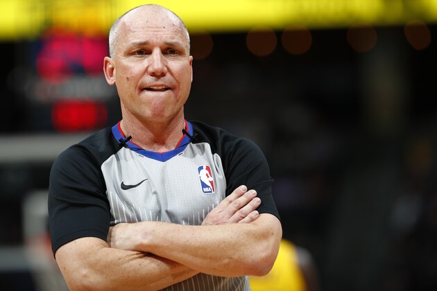 Referee Ron Garretson (10) in the first half of an NBA basketball game Friday, March 9, 2018, in Denver. (AP Photo/David Zalubowski)