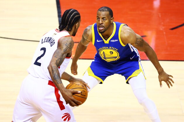 TORONTO, ONTARIO - MAY 30:  Kawhi Leonard #2 of the Toronto Raptors Warriors is defended by Andre Iguodala #9 of the Golden State Warriors in the second half during Game One of the 2019 NBA Finals at Scotiabank Arena on May 30, 2019 in Toronto, Canada. NOTE TO USER: User expressly acknowledges and agrees that, by downloading and or using this photograph, User is consenting to the terms and conditions of the Getty Images License Agreement. (Photo by Vaughn Ridley/Getty Images)