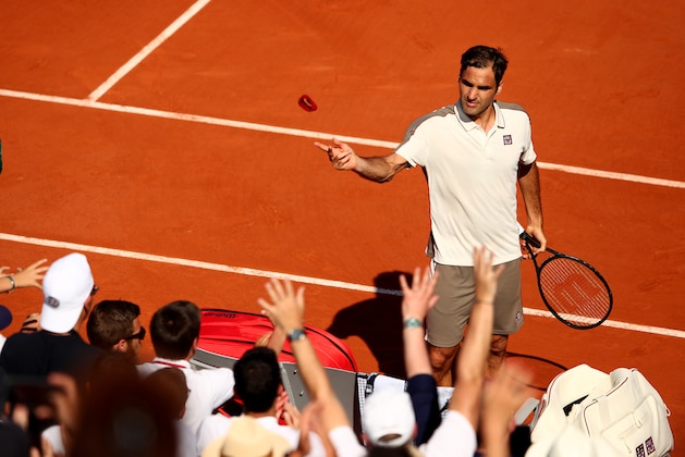 PARIS, FRANCE - MAY 31: Roger Federer of Switzerland throws his sweatband into the crowd during his mens singles third round match against Casper Ruud of Norway during Day six of the 2019 French Open at Roland Garros on May 31, 2019 in Paris, France. (Photo by Clive Brunskill/Getty Images)