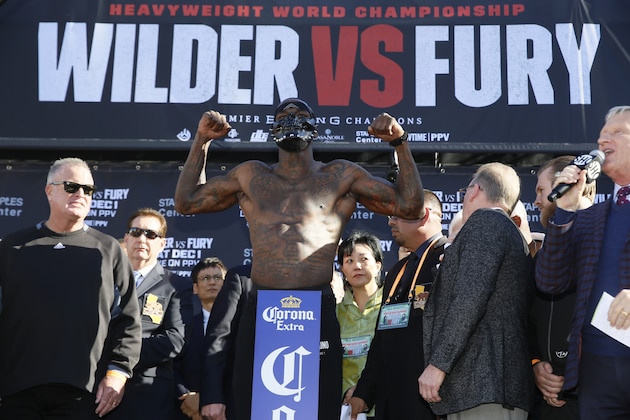 WBC heavyweight titleholder boxer Deontay Wilder wears a mask during his official weigh-in ceremony Friday, Nov. 30, 2018, at Staples Center in Los Angeles, ahead of his bout against boxer Tyson Fury. (AP Photo/Damian Dovarganes)