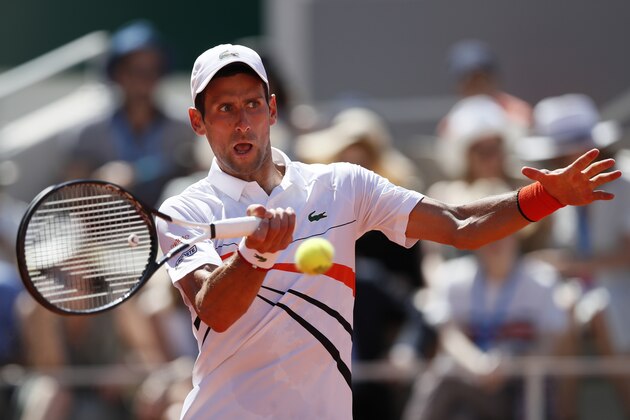 Serbia's Novak Djokovic plays a shot against Italy's Salvatore Caruso during their third round match of the French Open tennis tournament at the Roland Garros stadium in Paris, Saturday, June 1, 2019. (AP Photo/Christophe Ena )