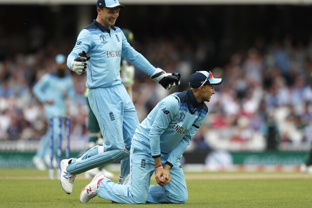 England's Joe Root holds onto the ball after taking a catch to dismiss South Africa's Imran Tahir off the bowling of England's Ben Stokes during their Cricket World Cup match at the Oval in London, Thursday, May 30, 2019. England won the match by 104 runs. (AP Photo/Frank Augstein)