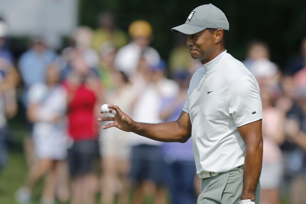 Tiger Woods waves to the crowd after making birdie on the first hole during the third round of the Memorial golf tournament Saturday, June 1, 2019, in Dublin, Ohio. (AP Photo/Jay LaPrete)