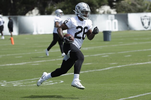 Oakland Raiders running back Josh Jacobs runs during an official team activity at the NFL football team's headquarters in Alameda, Calif., Tuesday, May 28, 2019. (AP Photo/Jeff Chiu)