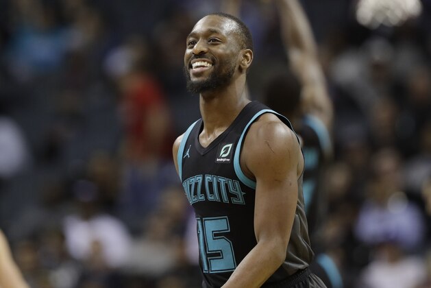 Charlotte Hornets' Kemba Walker (15) reacts after a basket against the Philadelphia 76ers during the second half of an NBA basketball game in Charlotte, N.C., Tuesday, March 19, 2019. (AP Photo/Chuck Burton)