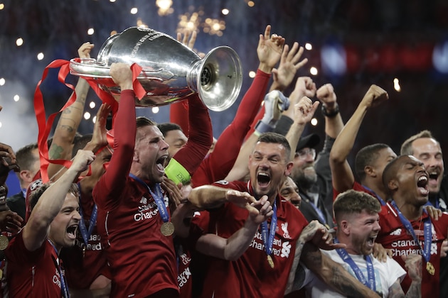 Liverpool's players celebrate with the trophy after winning the Champions League final soccer match between Tottenham Hotspur and Liverpool at the Wanda Metropolitano Stadium in Madrid, Sunday, June 2, 2019. Liverpool won 2-0. (AP Photo/Felipe Dana)
